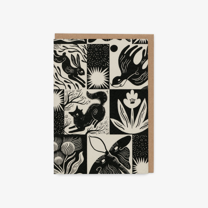 Greeting card with black and white animal illustrations on a beige background